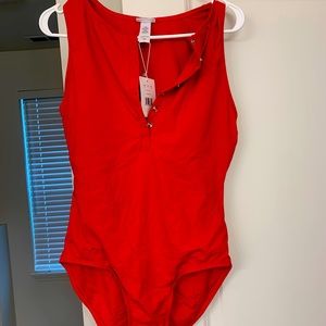 A sexy button down red one piece swimsuit from Andie. Brand new with tags.